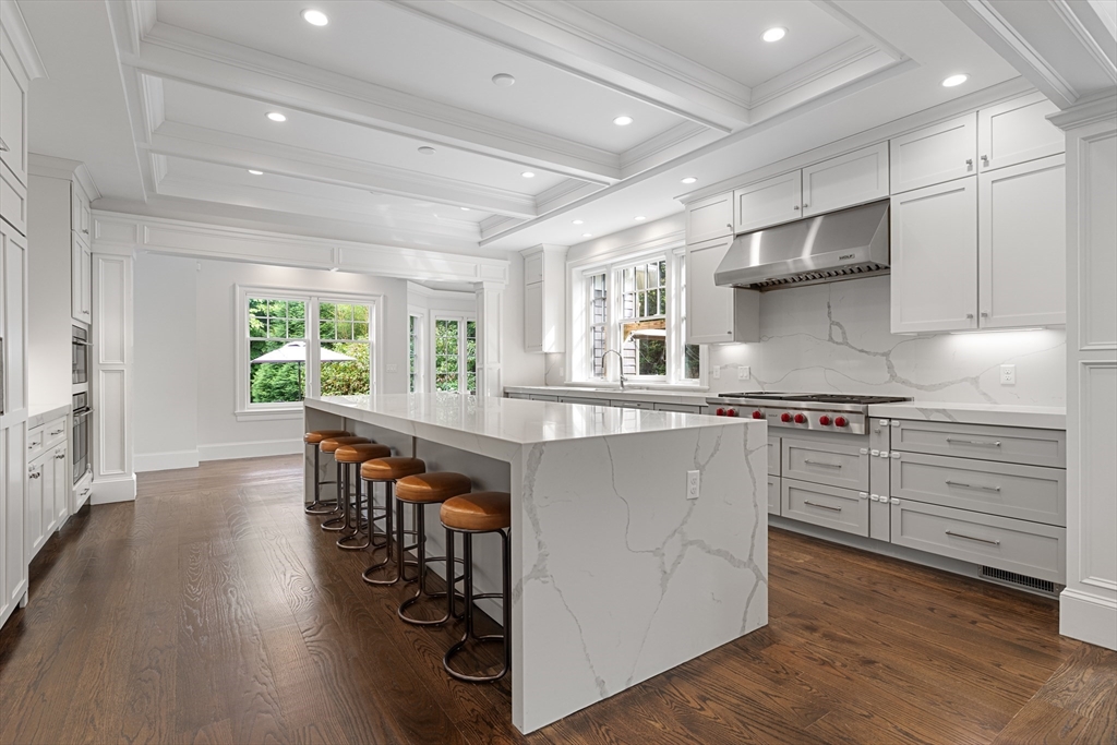 23 Crafts Road Brookline, MA 02467 - Photo 21 of 42 a kitchen with stainless steel appliances granite countertop a stove and a wooden floors