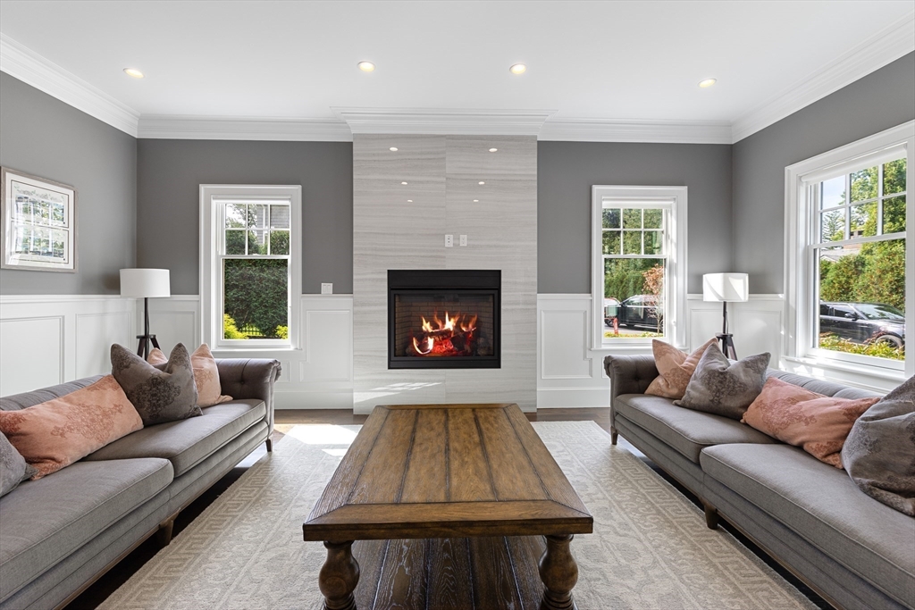 23 Crafts Road Brookline, MA 02467 - Photo 26 of 42 a living room with furniture and a fireplace