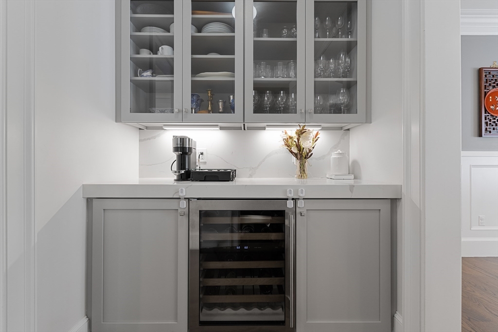 23 Crafts Road Brookline, MA 02467 - Photo 29 of 42 a view of a kitchen with stainless steel appliances cabinets and a window