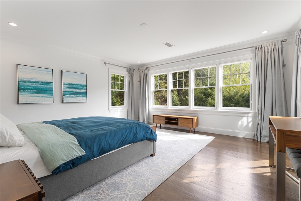 23 Crafts Road Brookline, MA 02467 - Photo 30 of 42 a spacious bedroom with a large bed and a large window