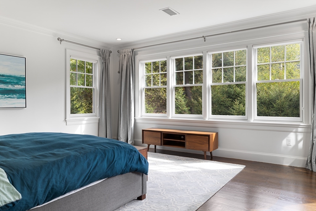 23 Crafts Road Brookline, MA 02467 - Photo 32 of 42 a spacious bedroom with a large bed and large window