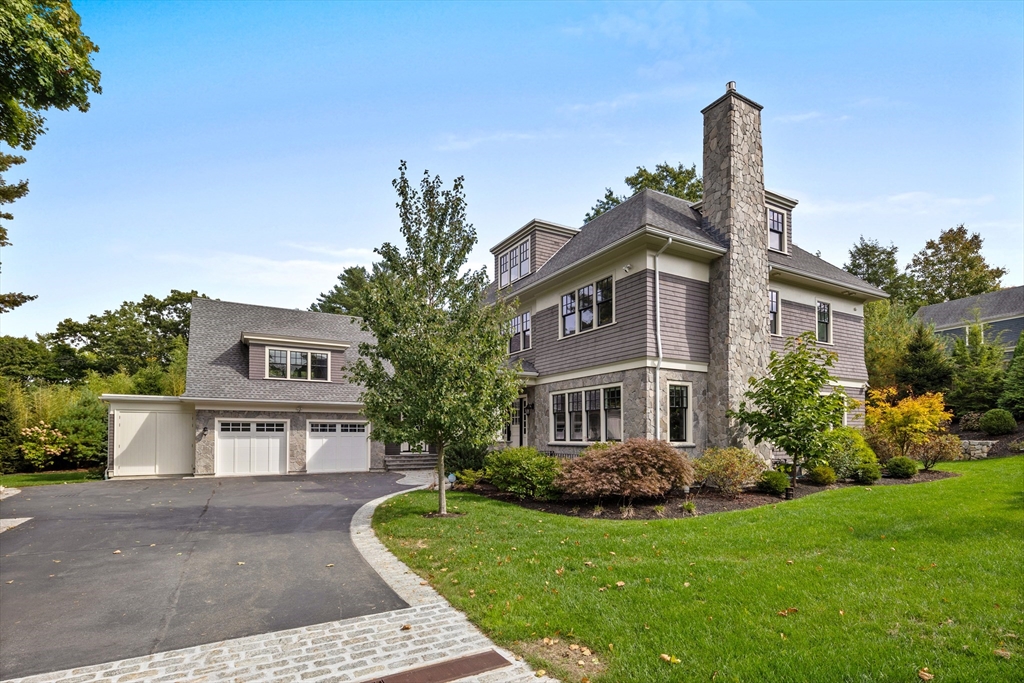 23 Crafts Road Brookline, MA 02467 - Photo 9 of 42 a front view of a house with a garden