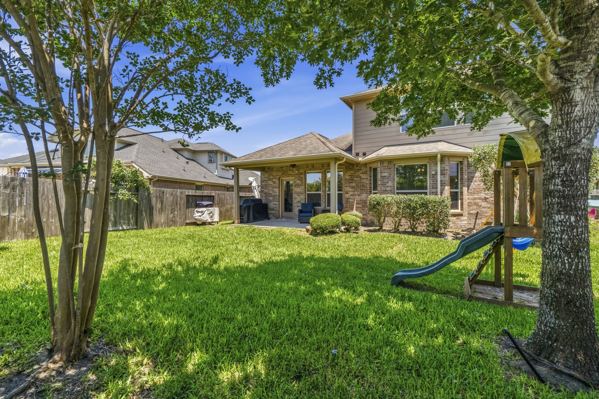 3900 Enchanted Timbers Lane Spring, TX 77386 - Photo 6 of 49 a front view of a house with yard and green space