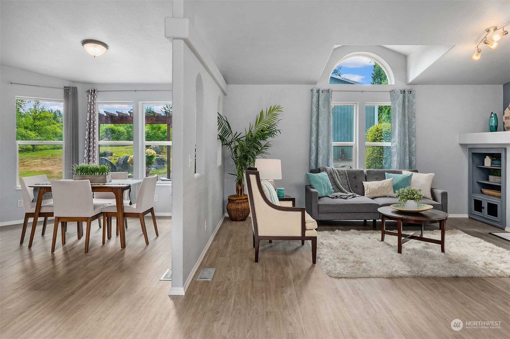 28932 Northeast Big Rock Road Duvall, WA 98019 - Photo 11 of 27 a living room with furniture a wooden floor and a window