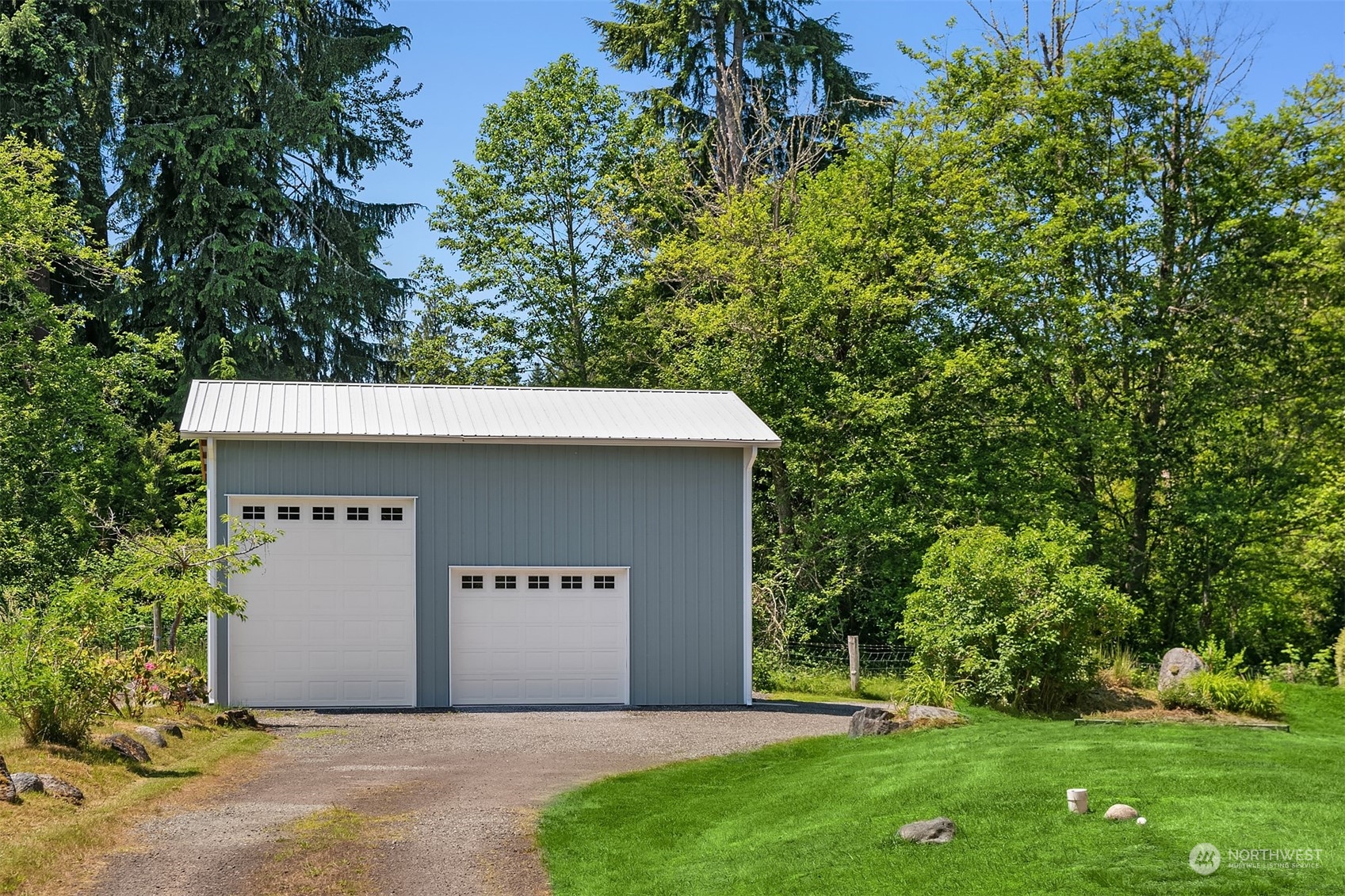 28932 Northeast Big Rock Road Duvall, WA 98019 - Photo 23 of 27 a front view of a house with a garden