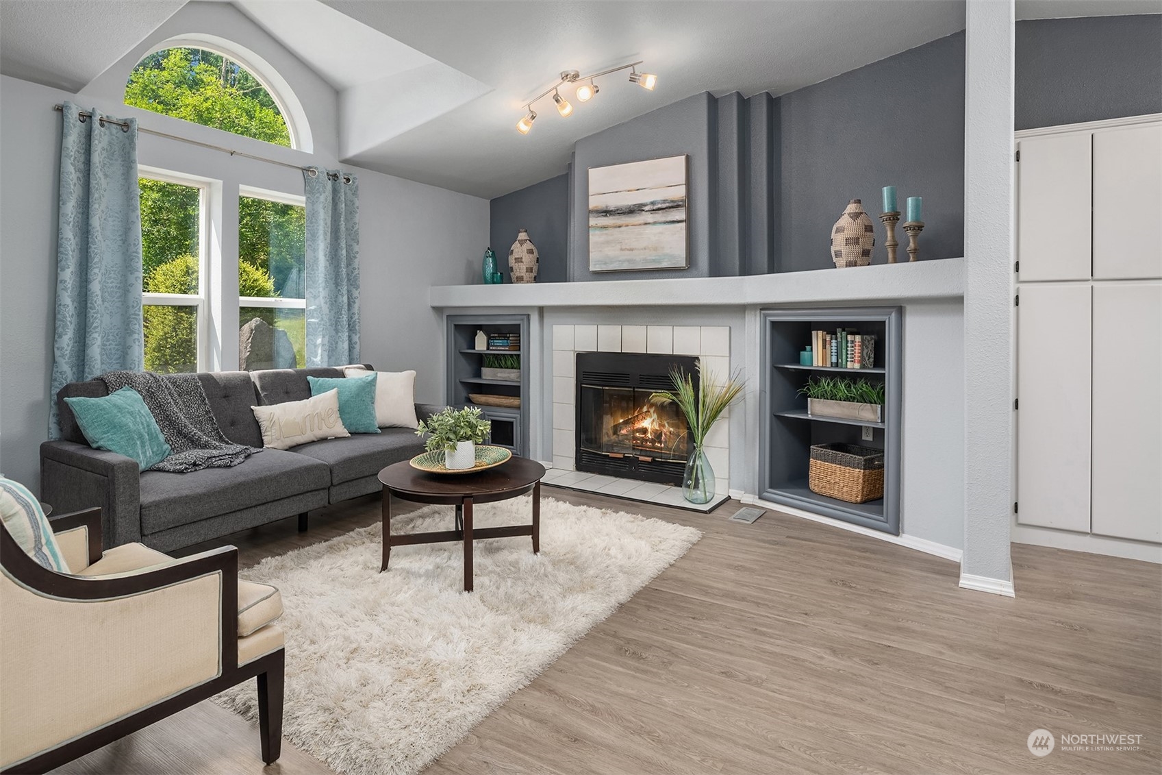 28932 Northeast Big Rock Road Duvall, WA 98019 - Photo 5 of 27 a living room with furniture and a fireplace