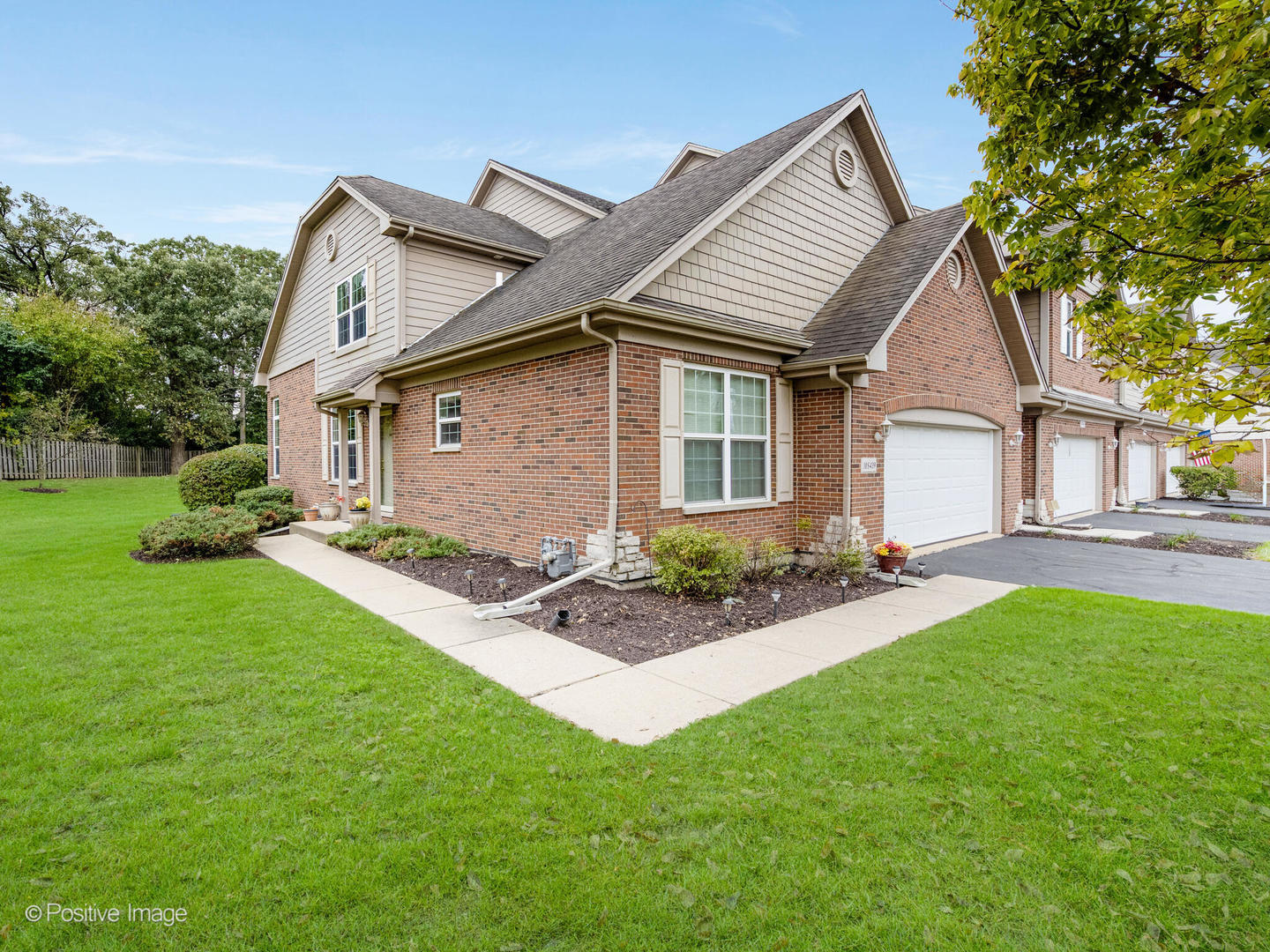 10 Carrington Circle Burr Ridge, IL 60527 - Photo 1 of 10 a front view of a house with a garden and yard