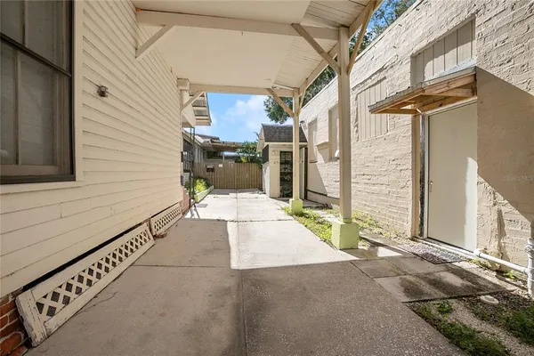 a view of front door with wooden floor and a rug