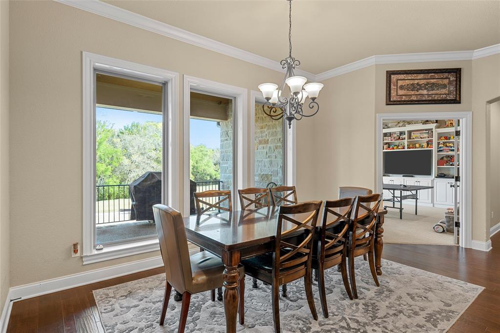 14690 Chapel Road Lorena, TX 76655 - Photo 10 of 40 a view of a dining room with furniture window and wooden floor