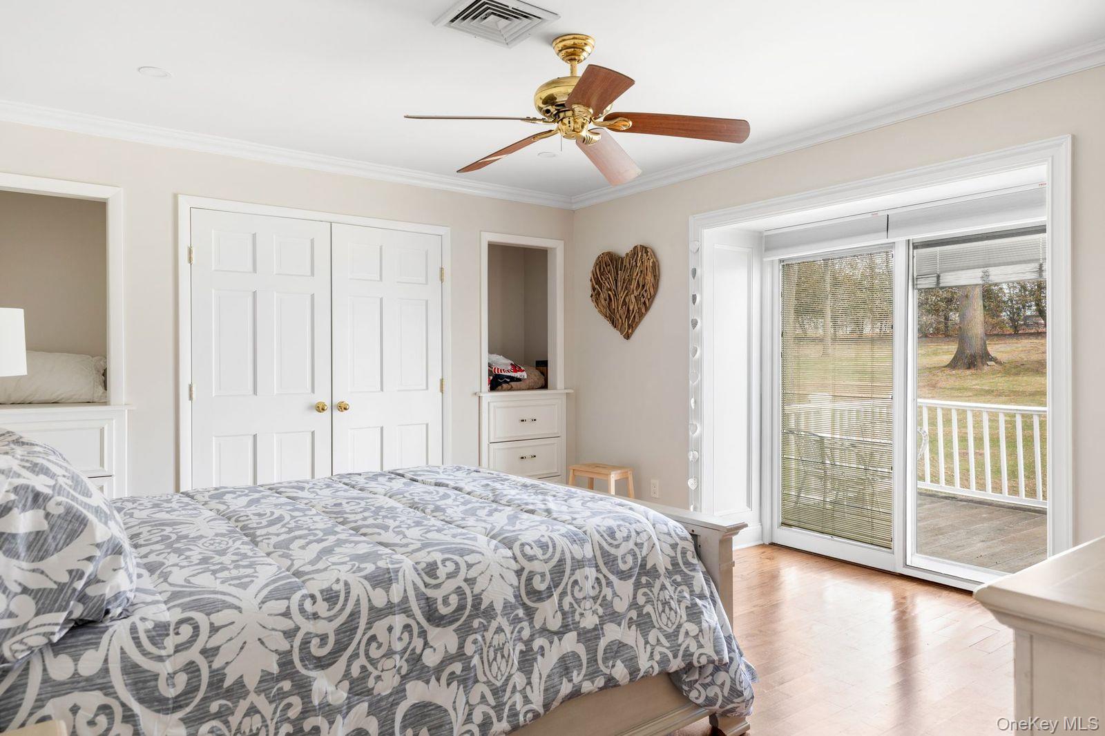 33 Beach Road Northport, NY 11768 - Photo 28 of 50 a bedroom with a large bed and a window