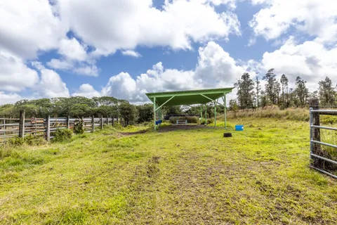 a swimming pool with outdoor seating and yard
