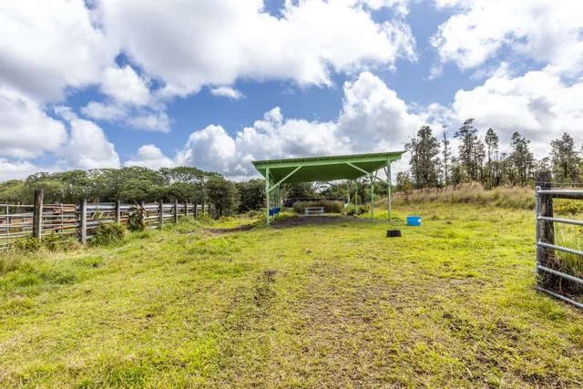 a swimming pool with outdoor seating and yard