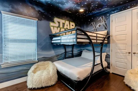 a bed room with furniture and a window