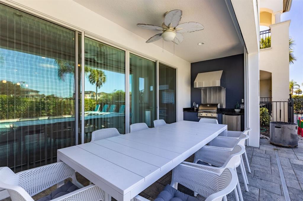 1036 Castle Pines Court Reunion, FL 34747 - Photo 32 of 50 a view of a dining room with furniture window and wooden floor
