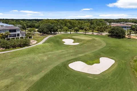 a view of a swimming pool with a yard
