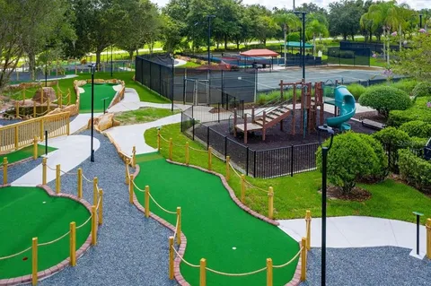 a view of a chairs and table in backyard