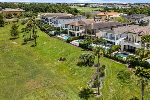 a view of a town with mountains in the background