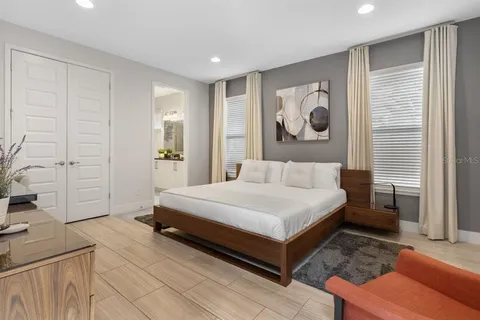 a bedroom with a bed and a cabinets