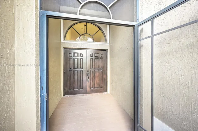 a view of a chandelier in an empty room