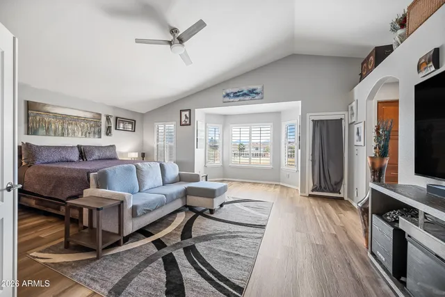 a spacious bathroom with a granite countertop tub sink shower and a mirror