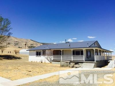 6220 Herschell Road Winnemucca, NV 89445 - Photo 1 of 1 a front view of a house with a yard
