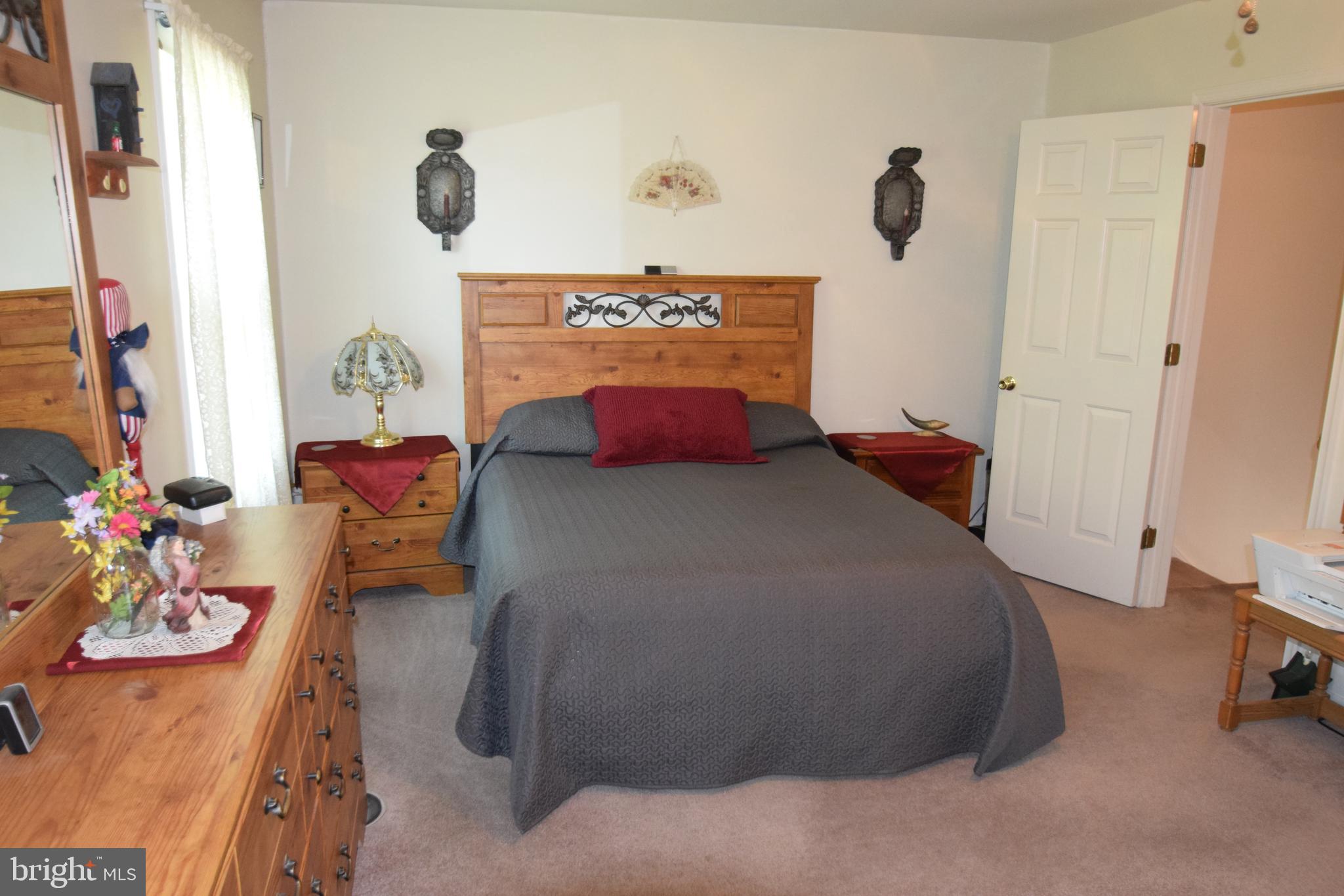 129 Woodhill Road Wilmington, DE 19809 - Photo 13 of 25 a bed room with a bed and a couch