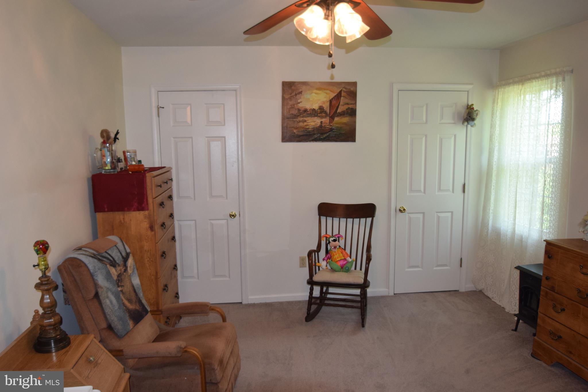 129 Woodhill Road Wilmington, DE 19809 - Photo 14 of 25 a living room with furniture a flat screen tv and a window
