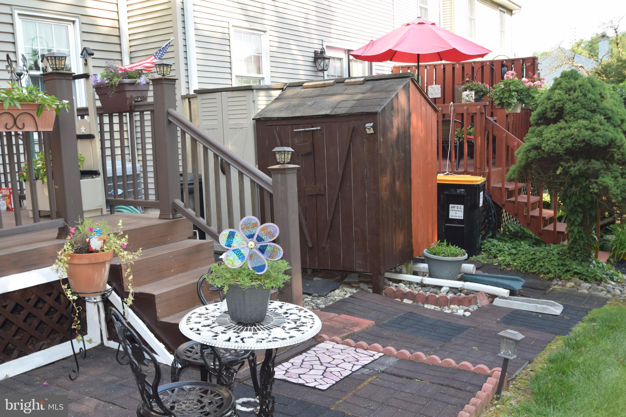 129 Woodhill Road Wilmington, DE 19809 - Photo 20 of 25 a patio with tables and chairs