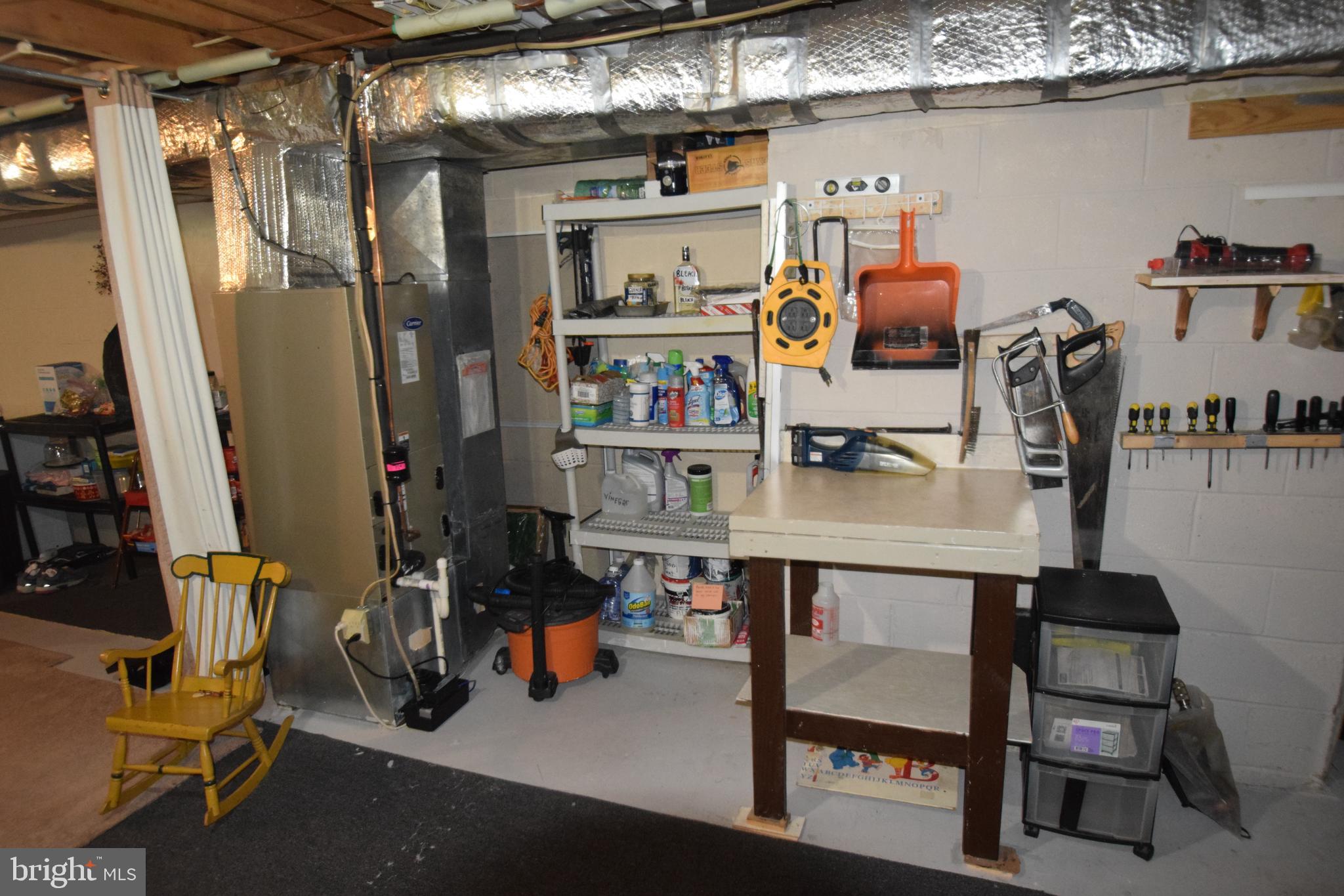 129 Woodhill Road Wilmington, DE 19809 - Photo 25 of 25 a room with furniture a air conditioner and a table