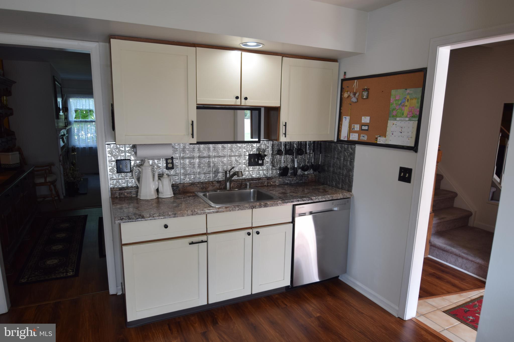 129 Woodhill Road Wilmington, DE 19809 - Photo 6 of 25 a bathroom with a sink and a mirror