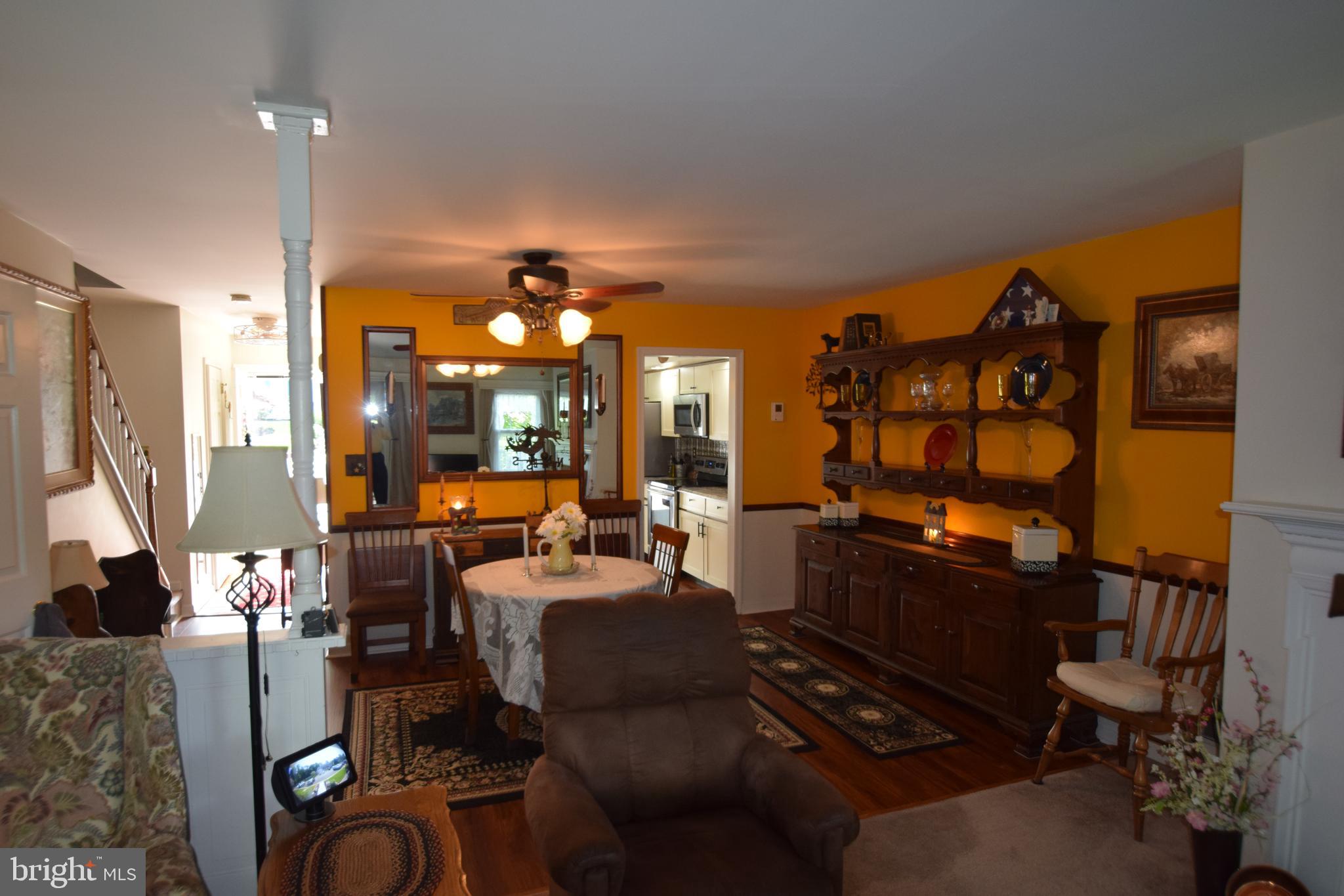 129 Woodhill Road Wilmington, DE 19809 - Photo 8 of 25 a living room with furniture a lamp a rug and a window