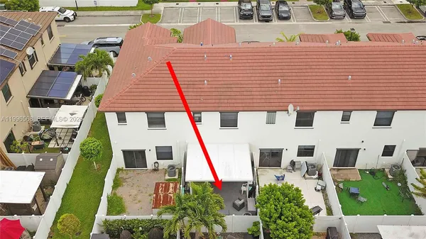 a aerial view of a house with a yard
