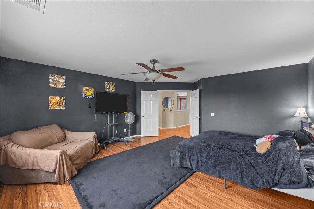 150 Saddleback Way Perris, CA 92570 - Photo 27 of 46 a living room with furniture and a flat screen tv