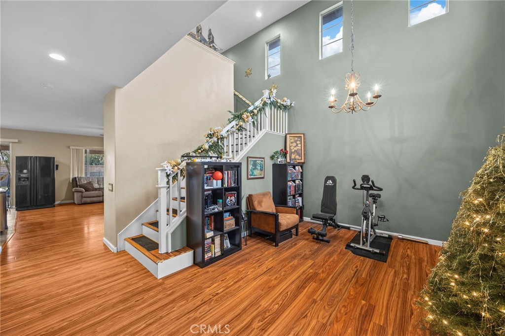 150 Saddleback Way Perris, CA 92570 - Photo 8 of 46 a view of a room with wooden floor and workspace