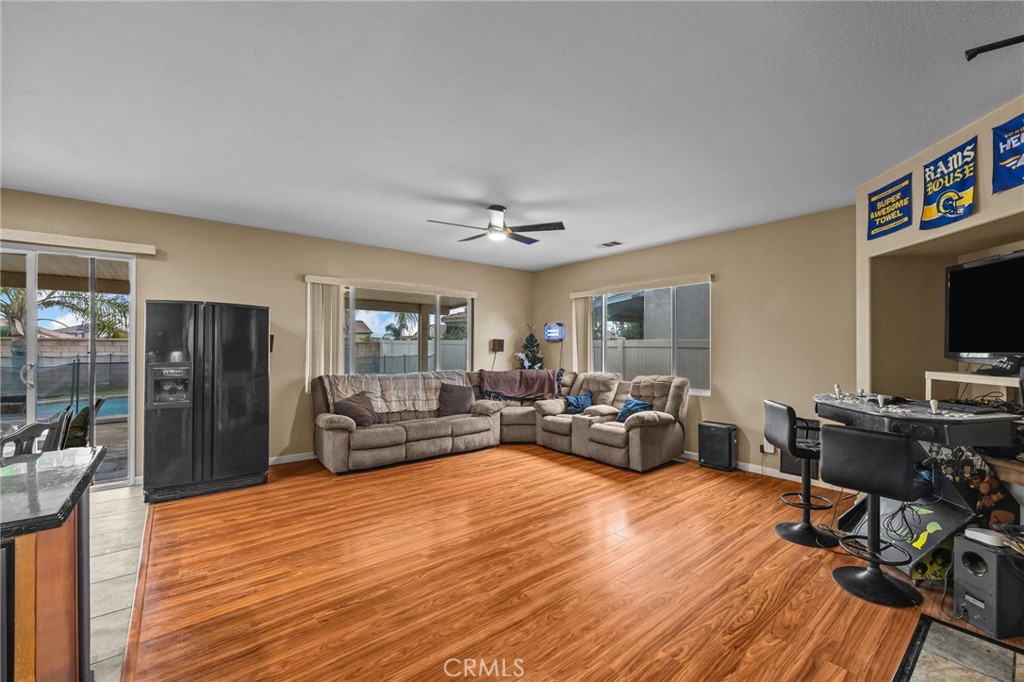 150 Saddleback Way Perris, CA 92570 - Photo 10 of 46 a living room with furniture and a flat screen tv