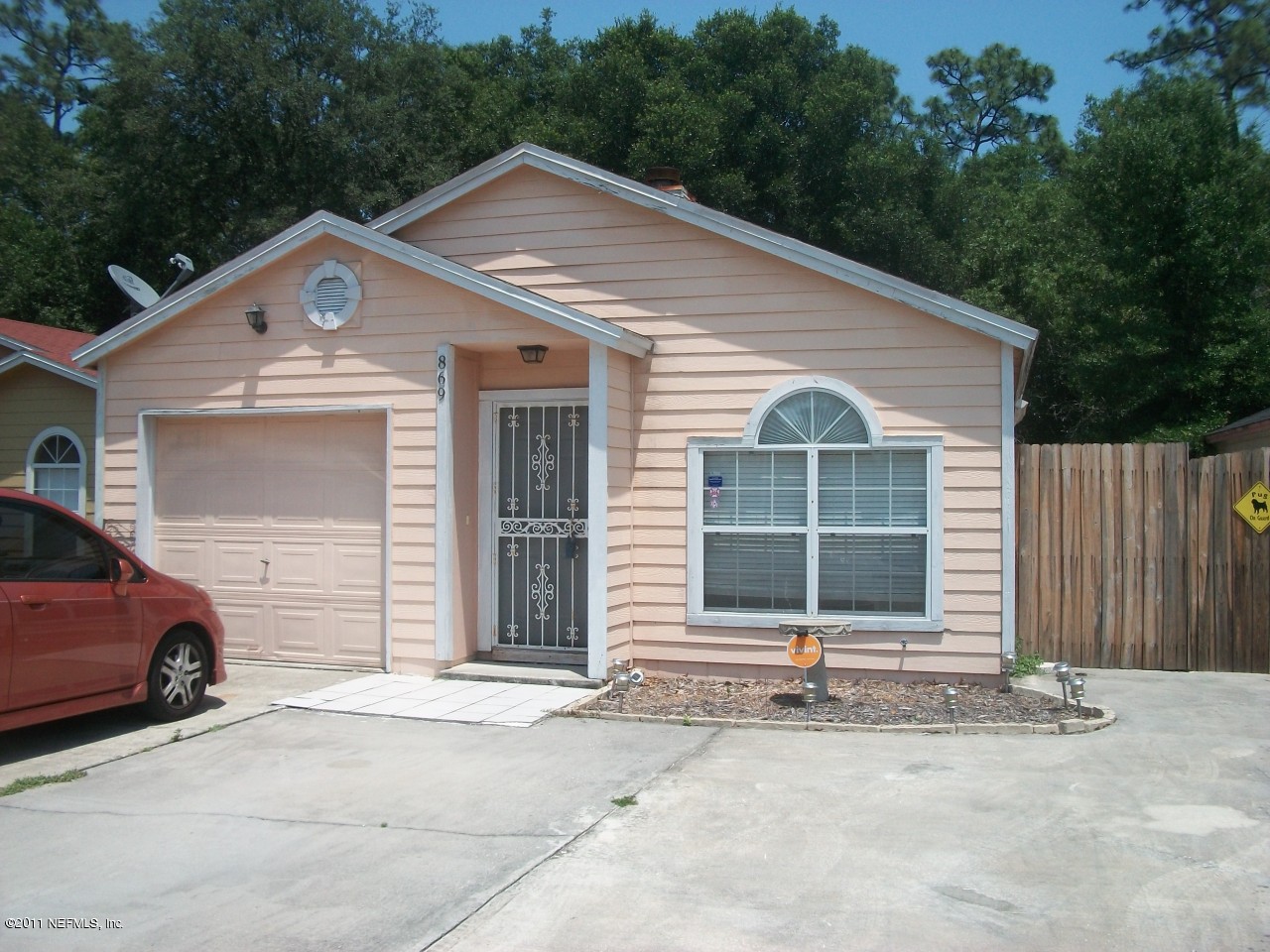 a front view of a house with a garage