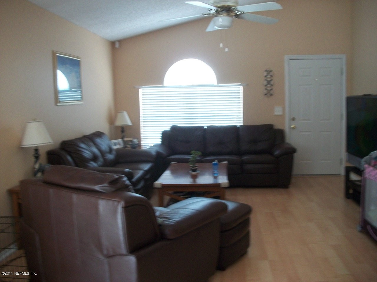 869 Jackson Road Jacksonville, FL 32225 - Photo 3 of 10 a living room with furniture and a flat screen tv
