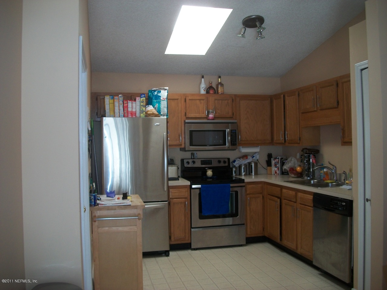 869 Jackson Road Jacksonville, FL 32225 - Photo 5 of 10 a kitchen with stainless steel appliances granite countertop a refrigerator and a stove top oven