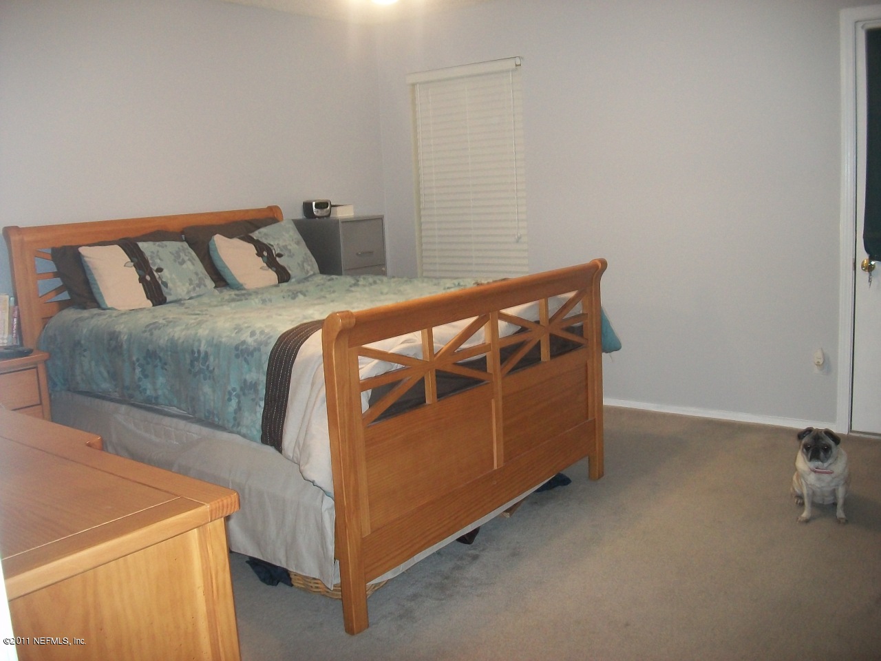 869 Jackson Road Jacksonville, FL 32225 - Photo 9 of 10 a bedroom with a bed and a dresser