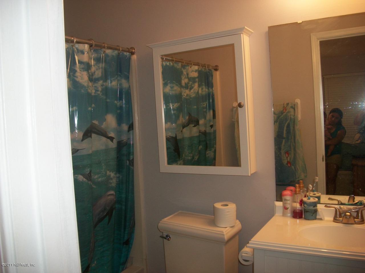 869 Jackson Road Jacksonville, FL 32225 - Photo 10 of 10 a bathroom with a toilet a sink and shower