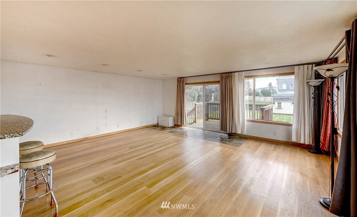 366 Earlington Avenue Southwest Renton, WA 98057 - Photo 11 of 33 a view of empty room with wooden floor and fan