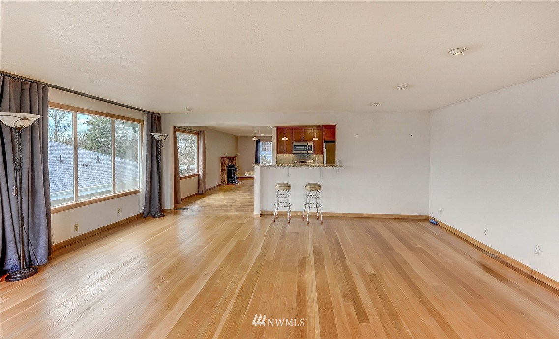 366 Earlington Avenue Southwest Renton, WA 98057 - Photo 15 of 33 a view of empty room with wooden floor and fan