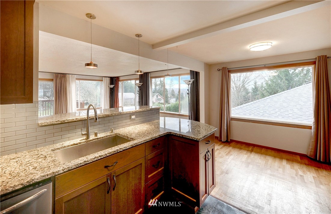 366 Earlington Avenue Southwest Renton, WA 98057 - Photo 10 of 33 a kitchen with granite countertop a sink and a window