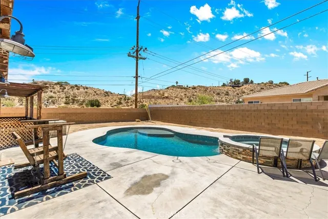 a view of a balcony with furniture