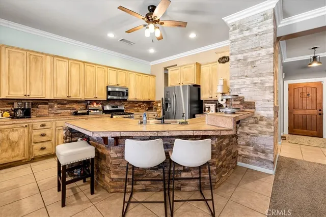 a dining table with chairs and window