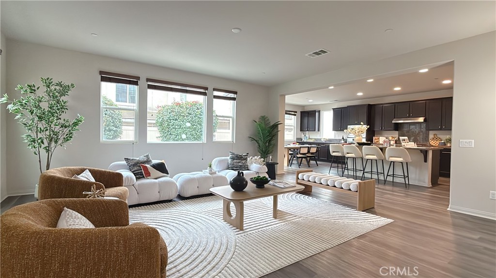 7833 Wild Rye Street Chino, CA 91708 - Photo 11 of 44 a living room with furniture and a large window