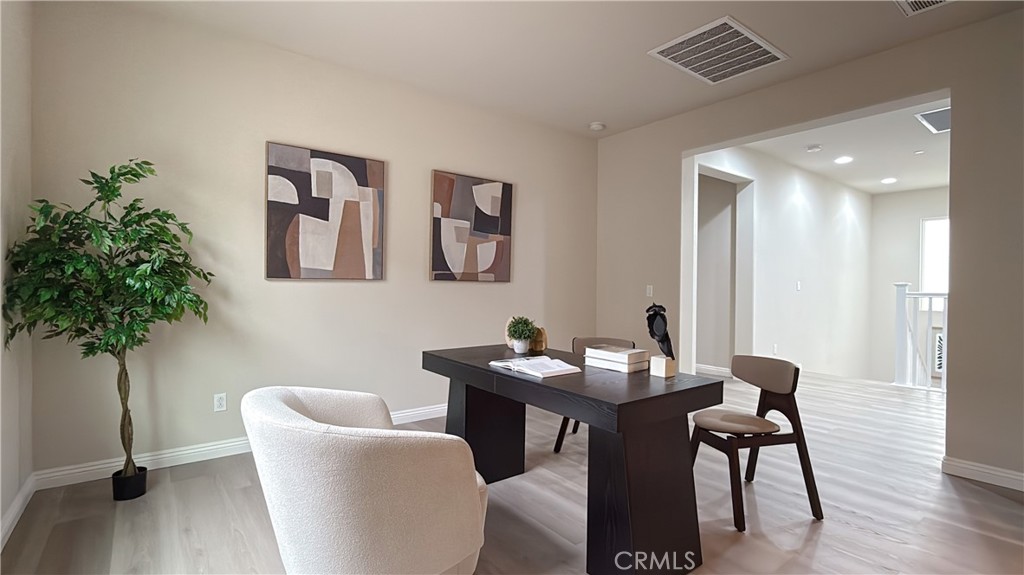 7833 Wild Rye Street Chino, CA 91708 - Photo 13 of 44 a dining room with furniture and wooden floor