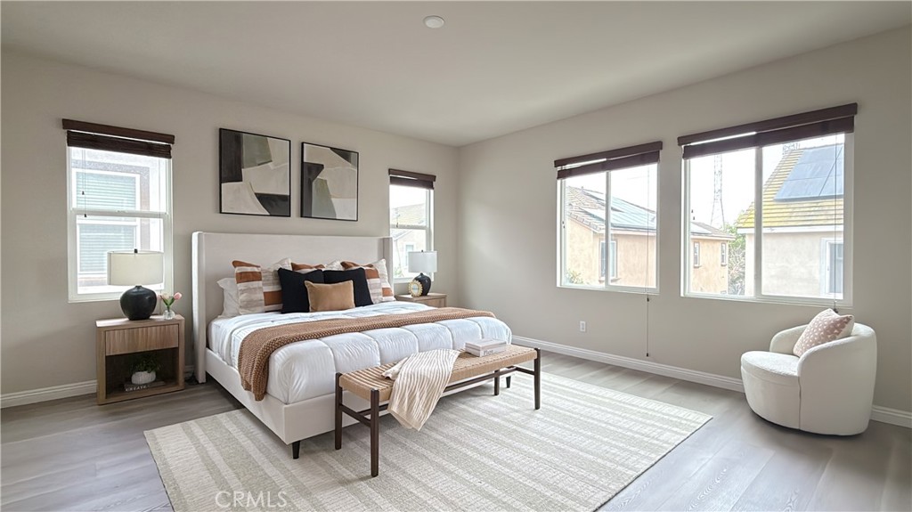 7833 Wild Rye Street Chino, CA 91708 - Photo 14 of 44 a bedroom with a bed and wooden floor