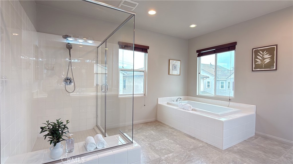 7833 Wild Rye Street Chino, CA 91708 - Photo 17 of 44 a spacious bathroom with a tub shower and sink
