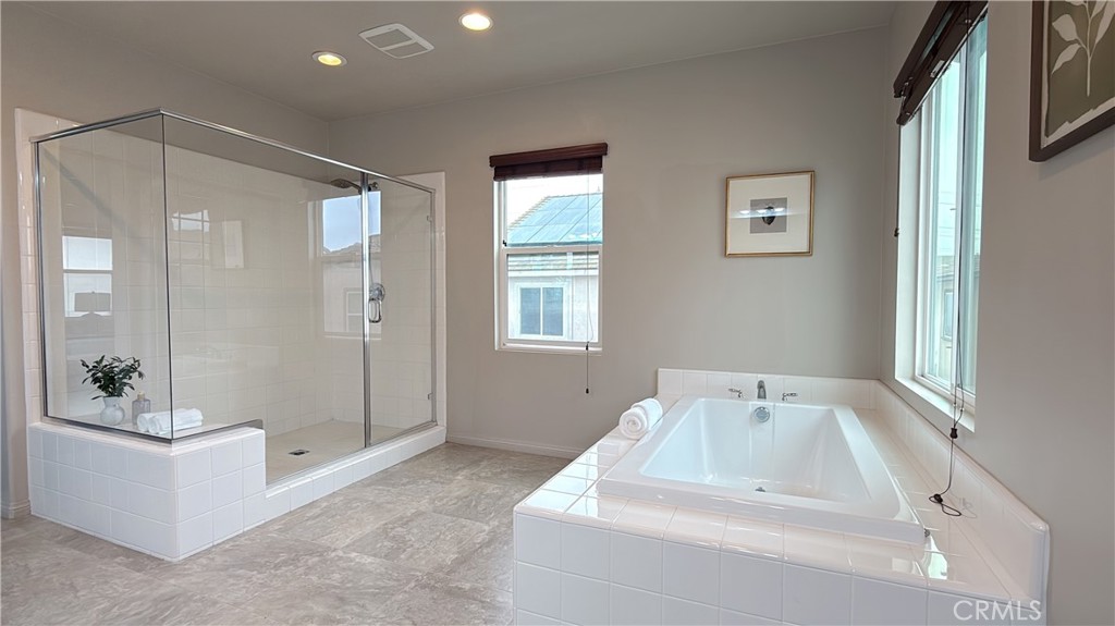 7833 Wild Rye Street Chino, CA 91708 - Photo 18 of 44 a bathroom with a sink and a bathtub